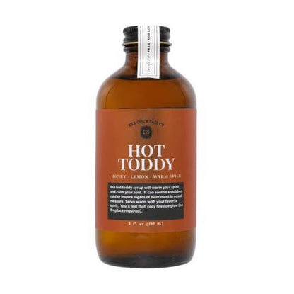 Bottle of Hot Toddy syrup with a label on a white background