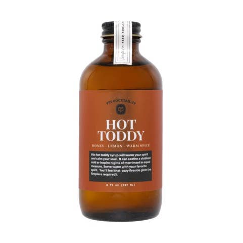 Bottle of Hot Toddy syrup with a label on a white background