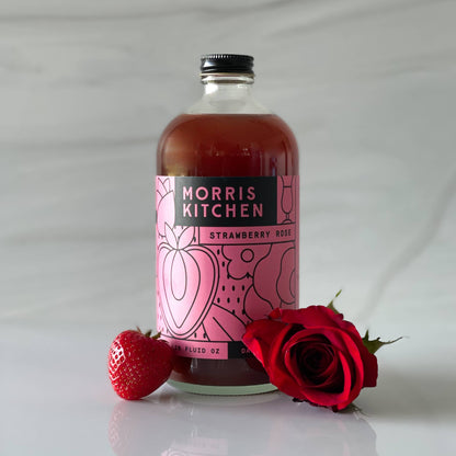 Bottle of Morris Kitchen Strawberry Rose with a strawberry and rose on a white background