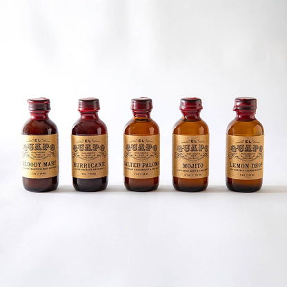 Five small bottles of El Guapo mini cocktails on a white background