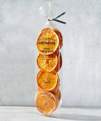Packaged orange slices with 'Dardimano California' branding on a light gray background