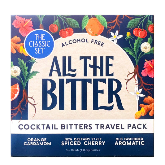 Box of 'All The Bitter' cocktail bitters travel pack with colorful botanical design on a blue background.