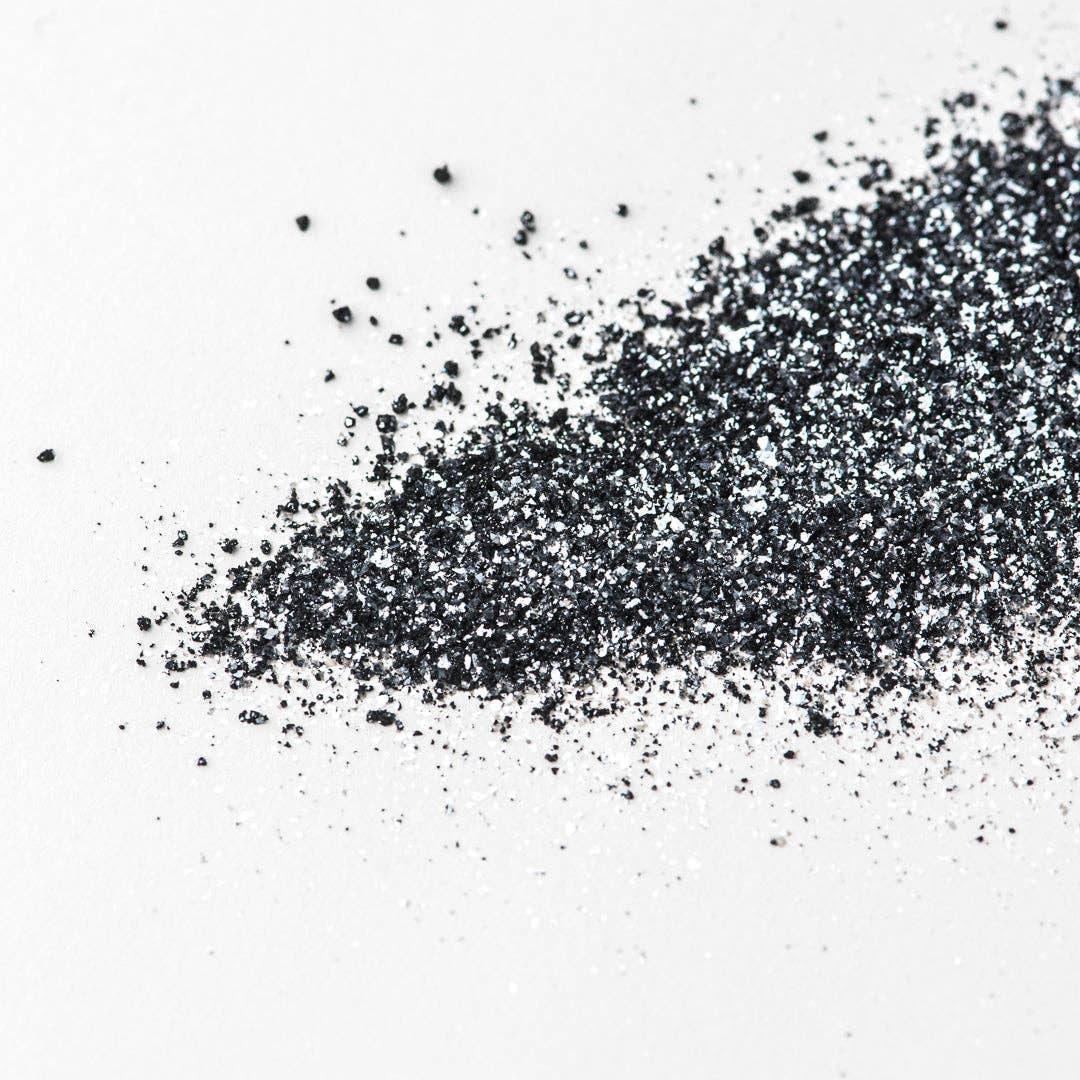 Black glitter on a white background