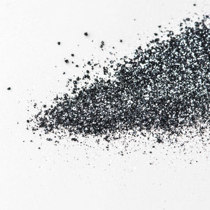 Black glitter on a white background