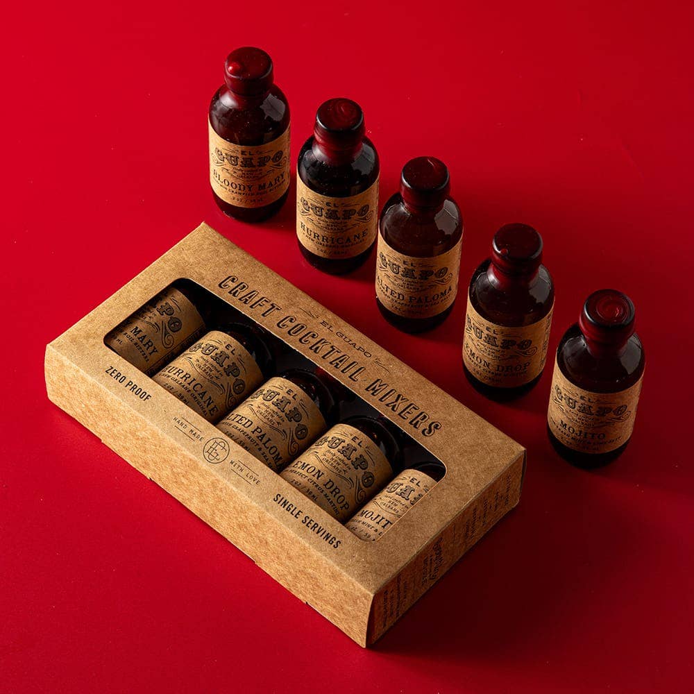 Set of small brown bottles with labels and a cardboard box on a red background